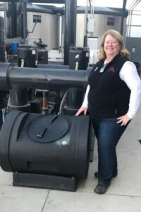 Woman with compost bin.